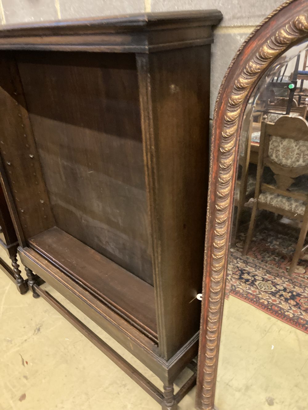 A 1920s oak open fronted bookcase, width 110cm depth 26cm height 141cm